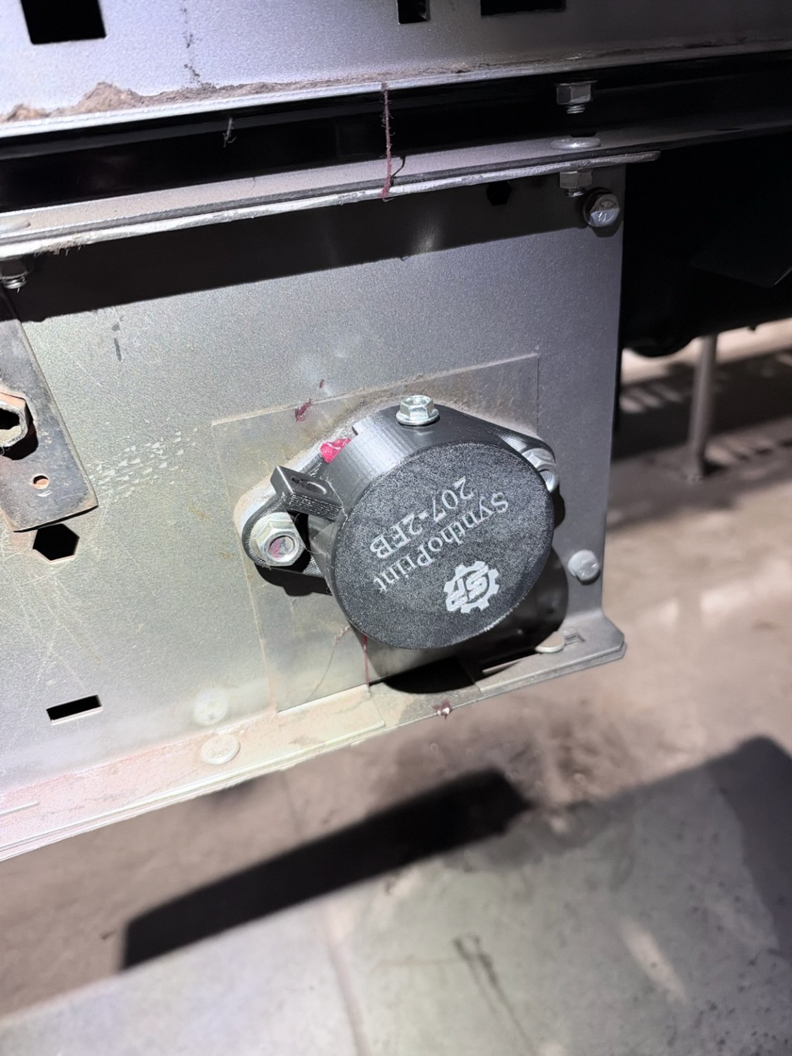 207-2FB guard installed on a conveyor mounting panel